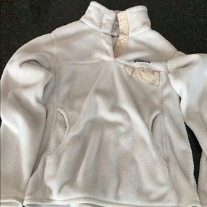 A white Patagonia pullover